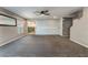 Large living space with gray walls and a view into the kitchen at 7219 Quiet Spring St, North Las Vegas, NV 89084