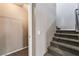 Carpeted staircase with access to a closet for storage, and modern railing at 7219 Quiet Spring St, North Las Vegas, NV 89084