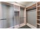 Spacious walk-in closet with ample shelving and metal hanging rods for optimal organization at 7219 Quiet Spring St, North Las Vegas, NV 89084