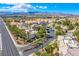 Wide aerial view of a neighborhood with mature landscaping, assigned parking, and mountain views at 7400 W Flamingo Rd # 1087, Las Vegas, NV 89147