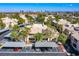 Aerial view of a residential complex featuring palm trees, landscaping, and assigned parking at 7400 W Flamingo Rd # 1087, Las Vegas, NV 89147
