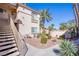 Well-maintained two-story exterior with landscaped grounds and staircase access at 7400 W Flamingo Rd # 1087, Las Vegas, NV 89147