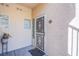 Inviting front door with decorative security screen, sidelight, and tile address plaque at 7400 W Flamingo Rd # 1087, Las Vegas, NV 89147