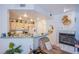An open-concept kitchen and living room with recessed lighting, a fireplace, and neutral décor at 7400 W Flamingo Rd # 1087, Las Vegas, NV 89147
