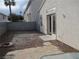 A nice backyard area features a stone patio and gravel landscaping with a door leading into the residence at 7904 Limbwood Ct, Las Vegas, NV 89131