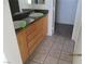 Bathroom with double sinks, granite countertops and tile flooring at 7904 Limbwood Ct, Las Vegas, NV 89131