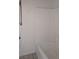 Bathroom featuring a tub/shower combo with white tile surround at 7904 Limbwood Ct, Las Vegas, NV 89131