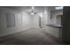 Open-concept living space with ample natural light, ceiling fan, and kitchen view at 7904 Limbwood Ct, Las Vegas, NV 89131