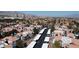 Aerial view of community with many units, carports, and nearby mountains at 8600 W Charleston Blvd # 1075, Las Vegas, NV 89117