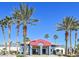 Inviting community building with palm trees and architectural details under a clear, bright sky at 8600 W Charleston Blvd # 1075, Las Vegas, NV 89117
