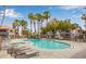 Relaxing community pool area featuring lounge chairs and beautiful landscaping at 8600 W Charleston Blvd # 1075, Las Vegas, NV 89117