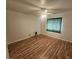 Bedroom featuring wood-look flooring and a ceiling fan with light at 901 E Jaybird St, Pahrump, NV 89048