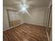 Large bedroom with hardwood floors and sliding closet doors at 901 E Jaybird St, Pahrump, NV 89048