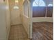 Entryway with tile flooring, a white front door, and view into a living room with wood flooring at 901 E Jaybird St, Pahrump, NV 89048