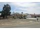 Charming single-story home featuring a well-maintained yard and a two-car garage at 901 E Jaybird St, Pahrump, NV 89048