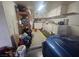 Organized garage with built in cabinets and storage at 901 E Jaybird St, Pahrump, NV 89048