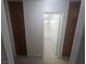 Hallway leading to bathroom, with cabinets on either side at 901 E Jaybird St, Pahrump, NV 89048