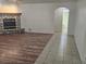 Spacious living room featuring tile floor, fireplace and entry to the bath at 901 E Jaybird St, Pahrump, NV 89048