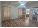 Spacious main bedroom featuring wood floors, sliding doors to bathroom, and closet at 901 E Jaybird St, Pahrump, NV 89048