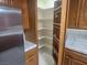 Walk-in pantry with adjustable shelving adjacent to kitchen at 901 E Jaybird St, Pahrump, NV 89048