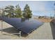 Ground-mounted solar panel array situated in the backyard of the property at 901 E Jaybird St, Pahrump, NV 89048