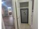 Hallway closet with a built-in safe and additional storage space at 901 E Jaybird St, Pahrump, NV 89048