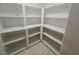 Walk-in pantry has ample storage with custom shelving at 901 E Jaybird St, Pahrump, NV 89048