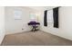 Bright bedroom with a window and neutral carpet, adaptable for various decor styles, provides a serene and inviting atmosphere at 9268 Wildfire Gorge St, Las Vegas, NV 89139