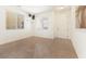 Bright entryway with tiled floors, neutral walls and a view of a door and two windows at 9268 Wildfire Gorge St, Las Vegas, NV 89139