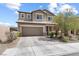 Charming two-story home with a two car garage and well-maintained front yard at 9268 Wildfire Gorge St, Las Vegas, NV 89139