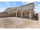 Exterior view of home showcases backyard with covered patio and balcony at 9268 Wildfire Gorge St, Las Vegas, NV 89139