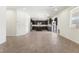 Open-concept area features a kitchen with an island and black cabinets at 9268 Wildfire Gorge St, Las Vegas, NV 89139