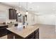 Open floor plan with kitchen island, stainless steel dishwasher, and access to the backyard at 9268 Wildfire Gorge St, Las Vegas, NV 89139
