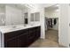 Gorgeous main bathroom with dual sinks, large mirror, and walk-in closet access at 9268 Wildfire Gorge St, Las Vegas, NV 89139