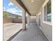 Covered patio with pavers overlooks the rear yard with block wall at 9268 Wildfire Gorge St, Las Vegas, NV 89139