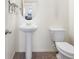 Charming powder room featuring a pedestal sink and modern fixtures. Fresh and clean aesthetic at 9268 Wildfire Gorge St, Las Vegas, NV 89139