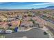 Expansive aerial view of a Las Vegas neighborhood showcasing well-maintained homes and desert landscaping under a clear, blue sky at 9359 Brownstone Ledge Ave, Las Vegas, NV 89149