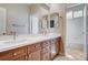 Bathroom featuring double sinks, vanity, and tiled floor with a tub/shower combo at 9359 Brownstone Ledge Ave, Las Vegas, NV 89149