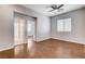 Bedroom with hardwood floors, ceiling fan, and ensuite bath at 9359 Brownstone Ledge Ave, Las Vegas, NV 89149