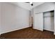 Bedroom featuring wood-look floors, closet, and a door to the ensuite at 9359 Brownstone Ledge Ave, Las Vegas, NV 89149