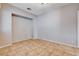 Bright bedroom with tile flooring and plenty of natural light at 9359 Brownstone Ledge Ave, Las Vegas, NV 89149