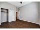 Bedroom showing wood-look floors, a closet with sliding doors, and ensuite entrance at 9359 Brownstone Ledge Ave, Las Vegas, NV 89149