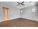 Large bedroom with wood floors, ceiling fan, neutral paint and attached bathroom at 9359 Brownstone Ledge Ave, Las Vegas, NV 89149