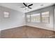 Spacious bedroom featuring wood floors, neutral paint, ceiling fan and abundant windows at 9359 Brownstone Ledge Ave, Las Vegas, NV 89149