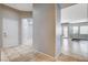 Spacious hallway featuring neutral paint, white trim, and opening to several rooms at 9359 Brownstone Ledge Ave, Las Vegas, NV 89149