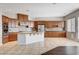 Open kitchen features stainless steel appliances, granite countertops, and a large island at 9359 Brownstone Ledge Ave, Las Vegas, NV 89149