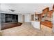 Spacious living room with built-in shelving, open floor plan to kitchen at 9359 Brownstone Ledge Ave, Las Vegas, NV 89149