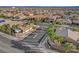 Upscale gated Las Vegas community entrance with palm trees and meticulously landscaped surroundings at 9359 Brownstone Ledge Ave, Las Vegas, NV 89149