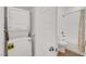 Convenient laundry area adjacent to a well-appointed bathroom with modern finishes at 965 Nevada State Dr # 6101, Henderson, NV 89002