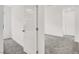 A bright bedroom has new carpet and fresh white walls, and a white paneled door at 965 Nevada State Dr # 6101, Henderson, NV 89002